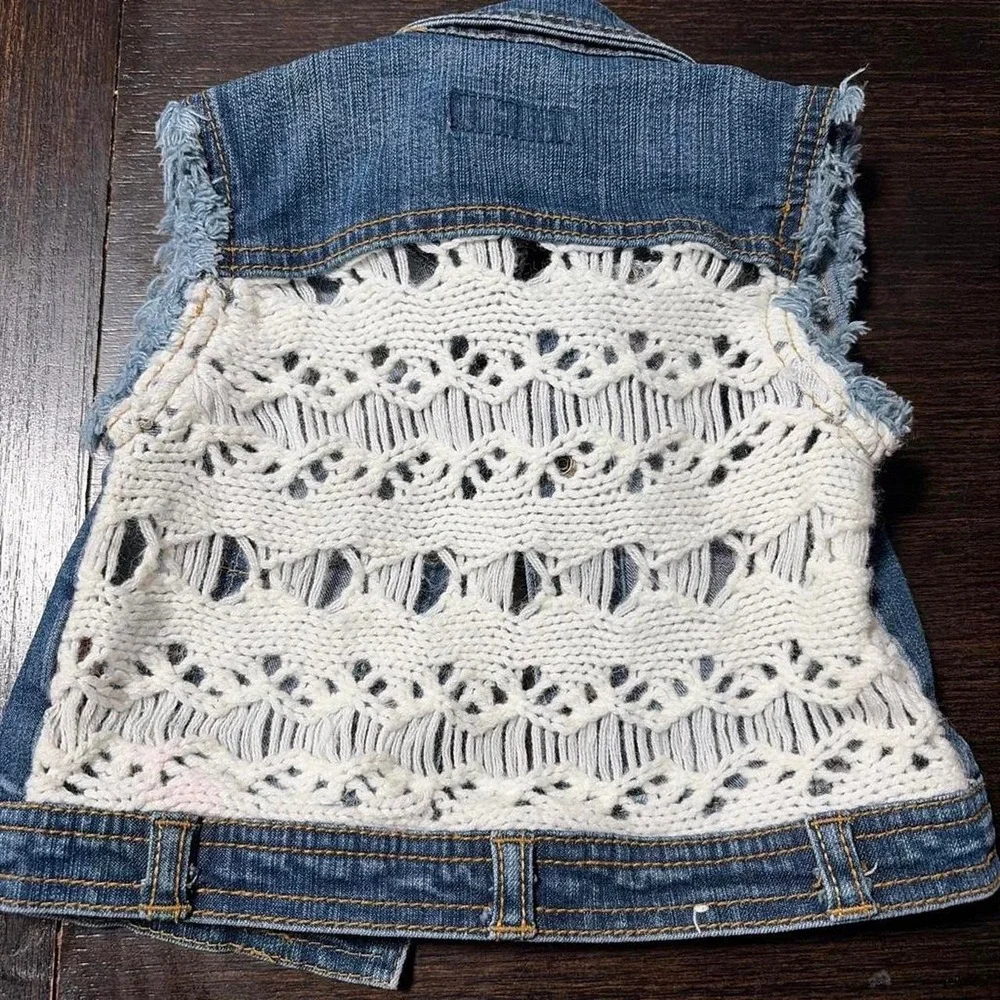 blue denim vest with frayed hem